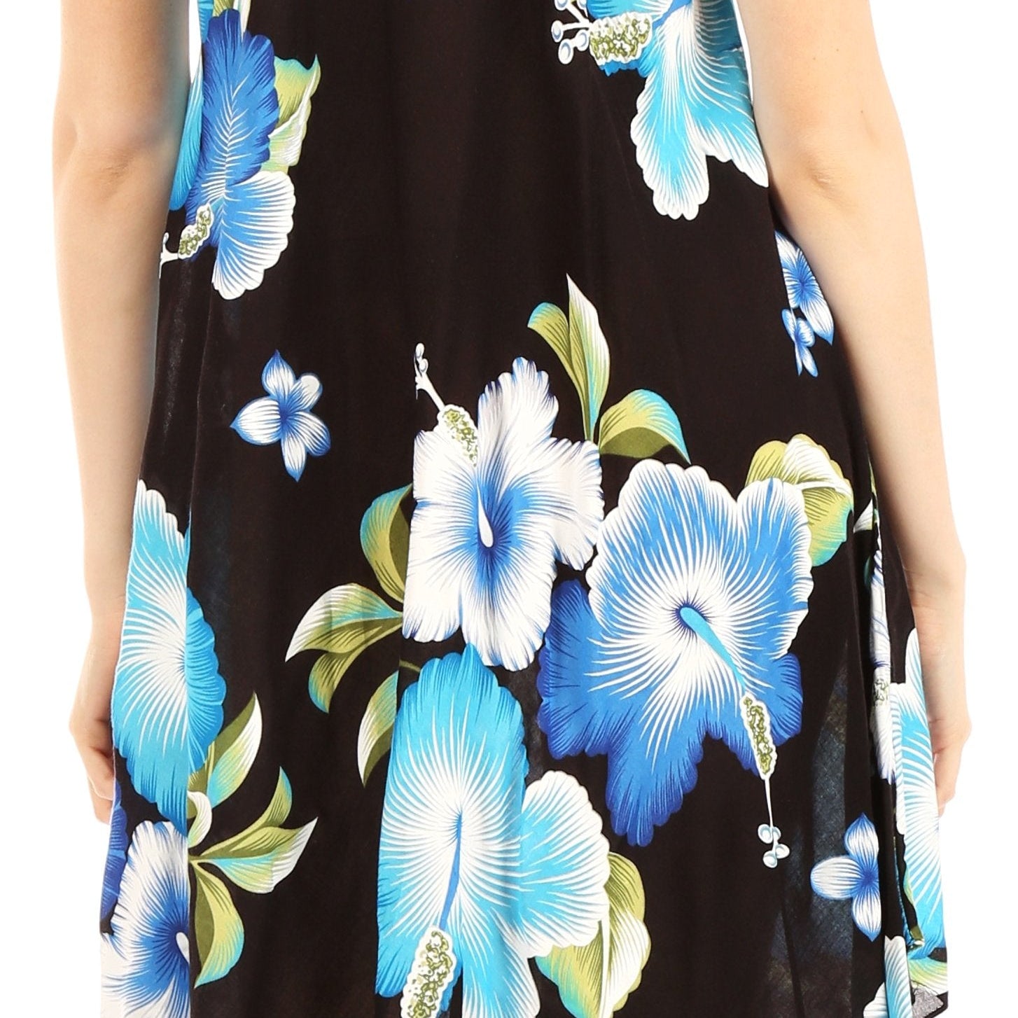 Woman wearing a sleeveless dress with blue floral pattern on black background