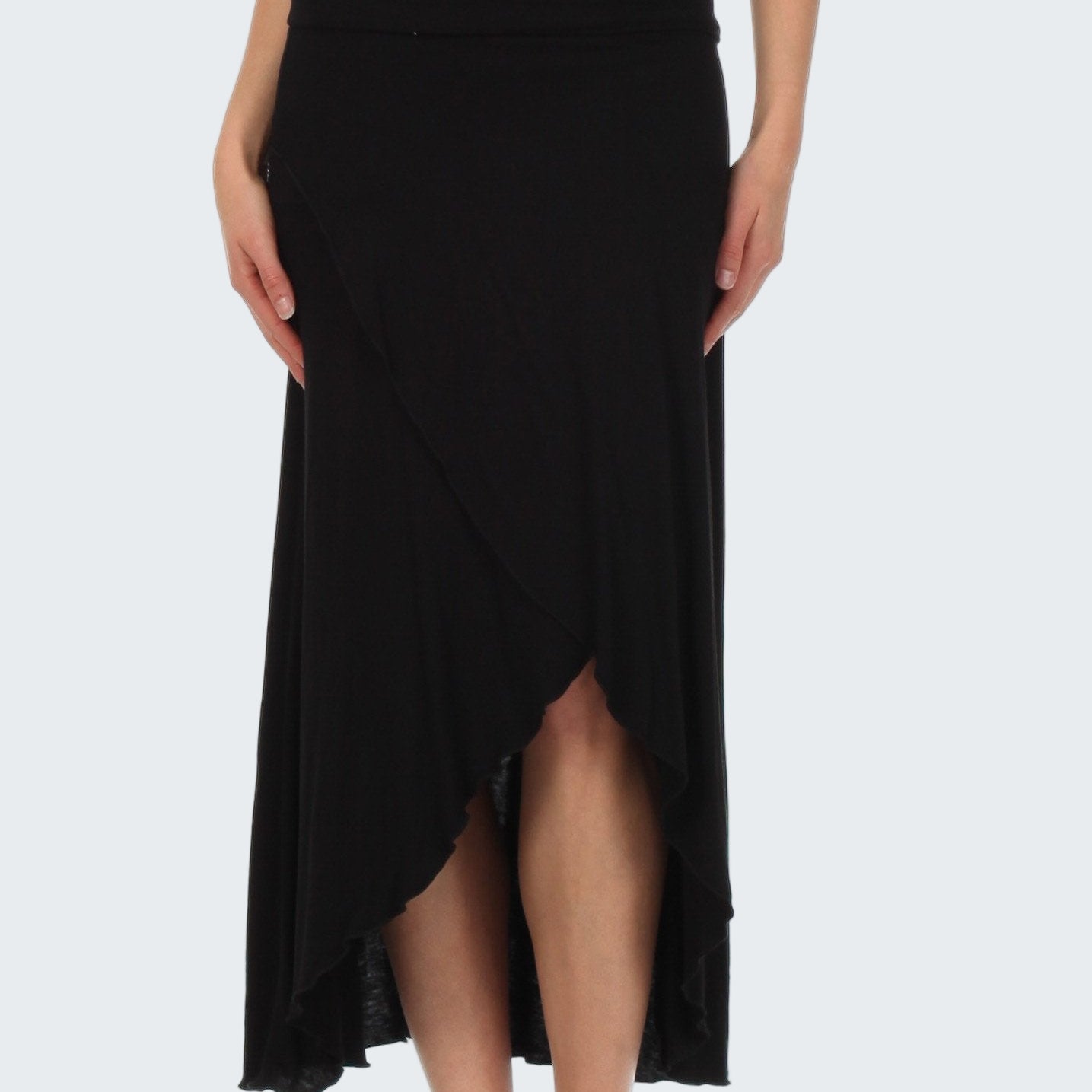 Black skirt worn by a person on a white background