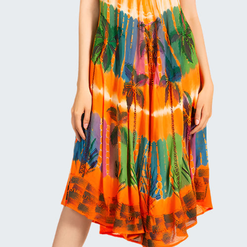 Woman wearing a colorful tie-dye dress on a white background