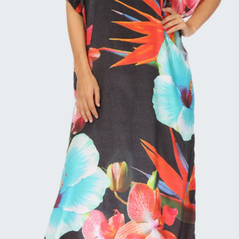 Black dress with colorful floral pattern worn by a model on a white background