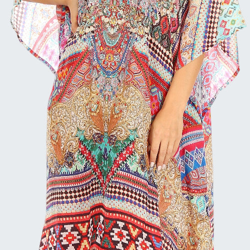 Colorful patterned dress worn by a model on a white background