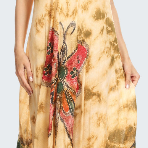 Woman wearing a tie-dye dress with floral patterns on a beige background