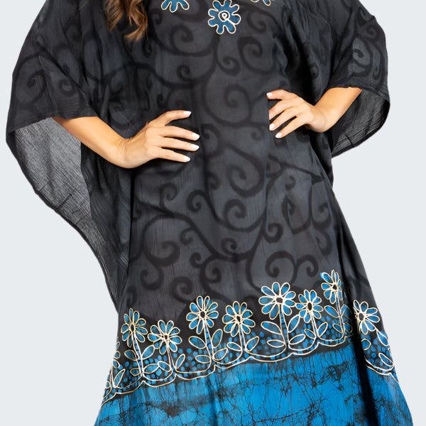 Black and blue patterned dress with floral designs on a white background