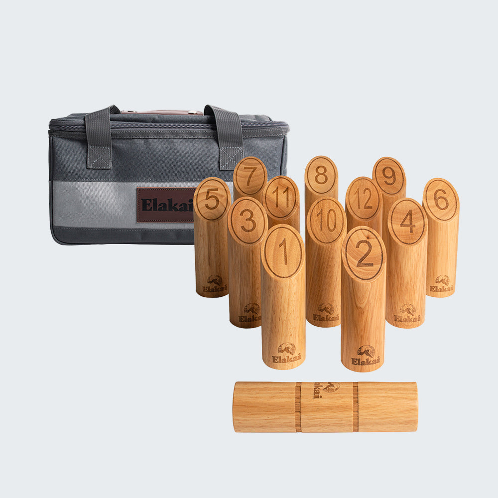 Wooden bowling pins with numbers and a carrying case on a white background