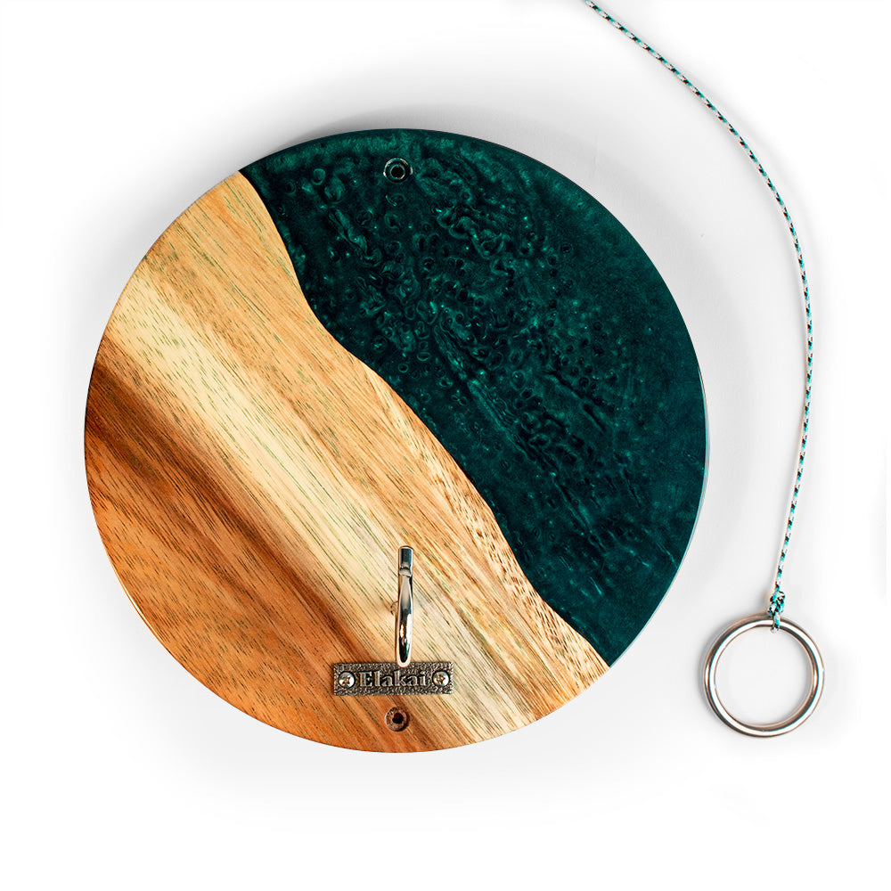 Round wooden and green resin wall hook with a brand logo on a white background