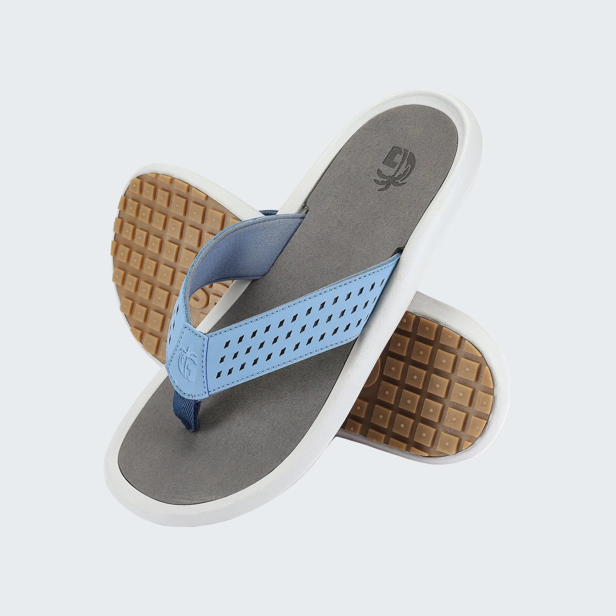 Pair of sandals with blue straps and brown soles on a white background