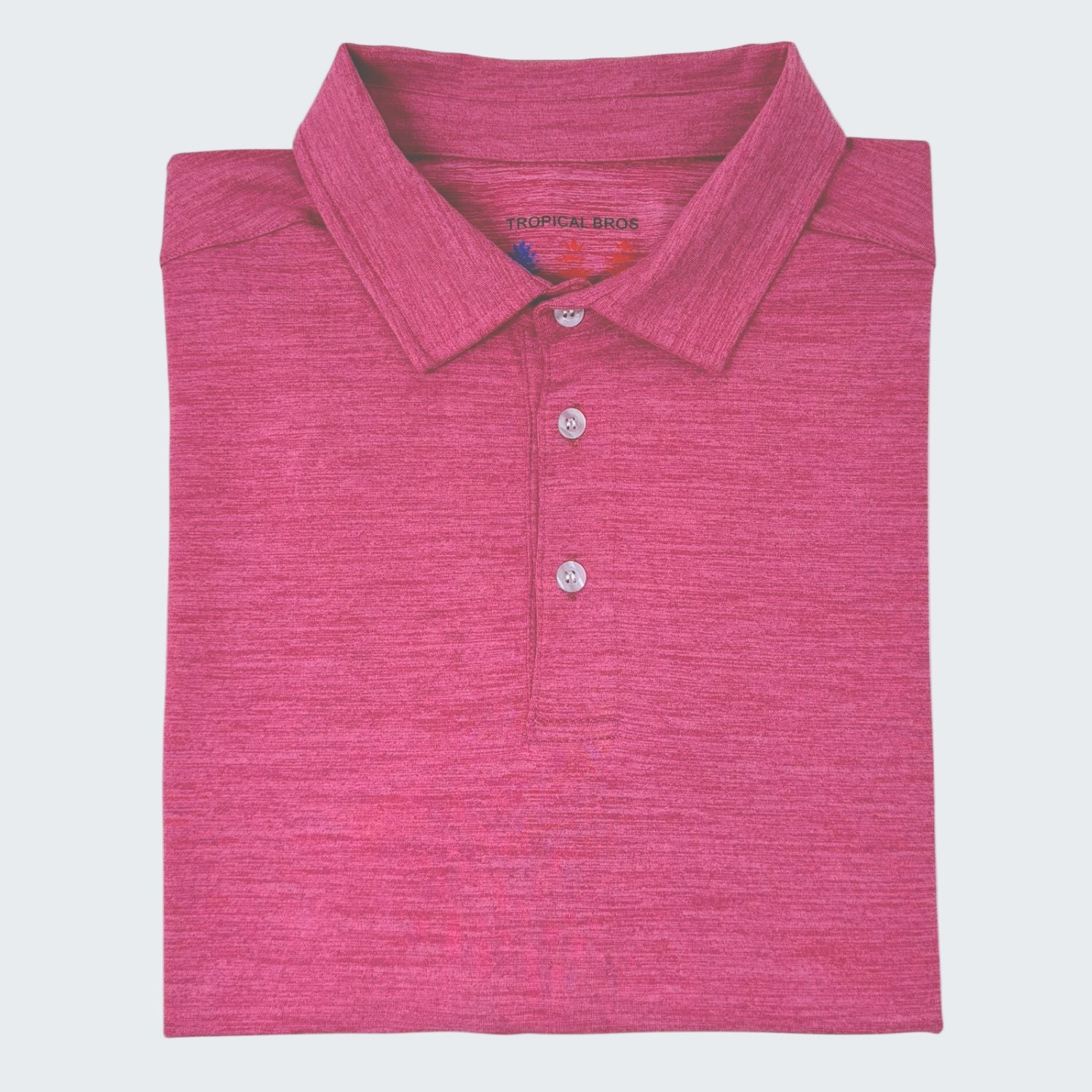 Folded pink polo shirt on a white background