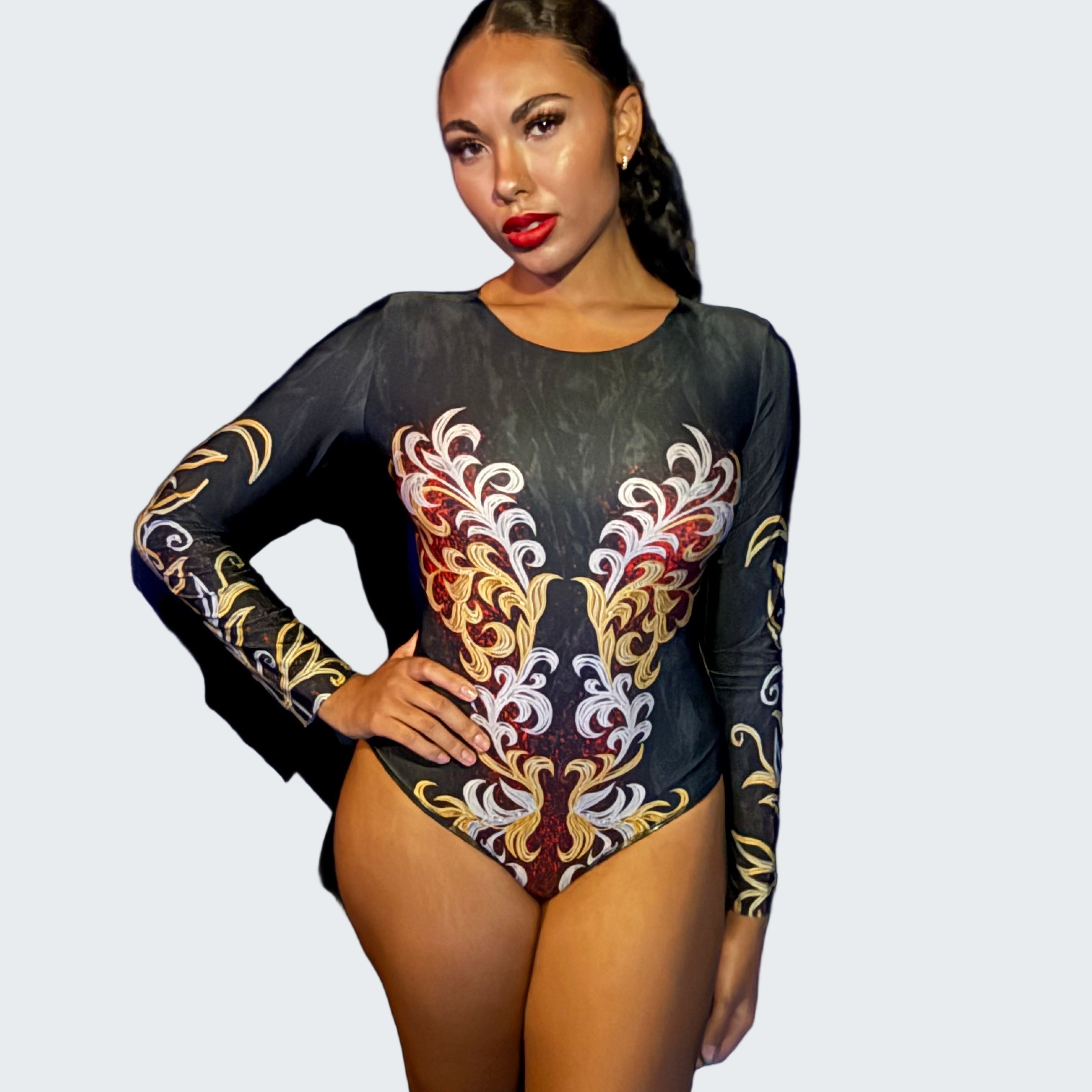 Person wearing a black leotard with colorful floral patterns against a blue curtain.