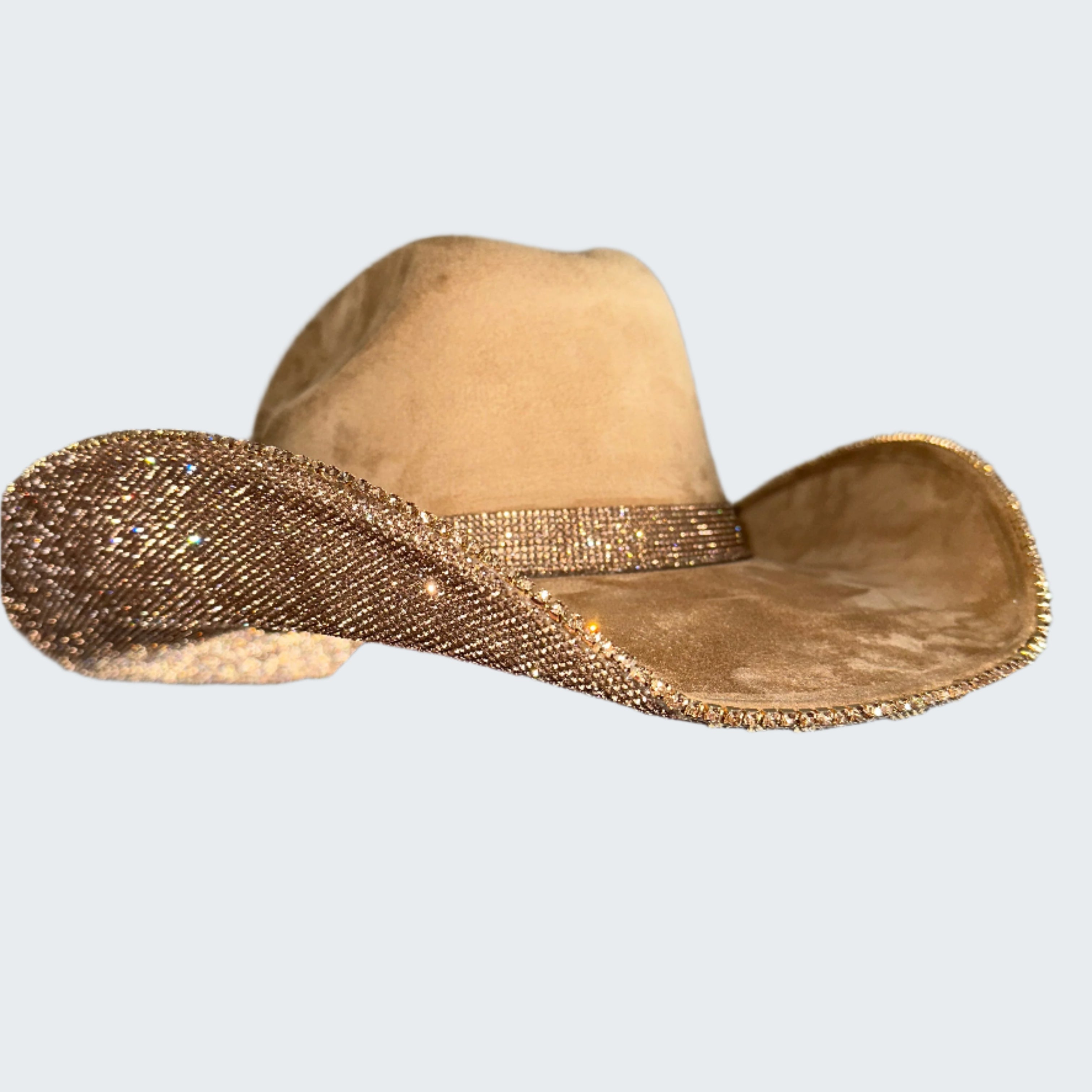 Beige cowboy hat with a wide brim held by a hand against a neutral background
