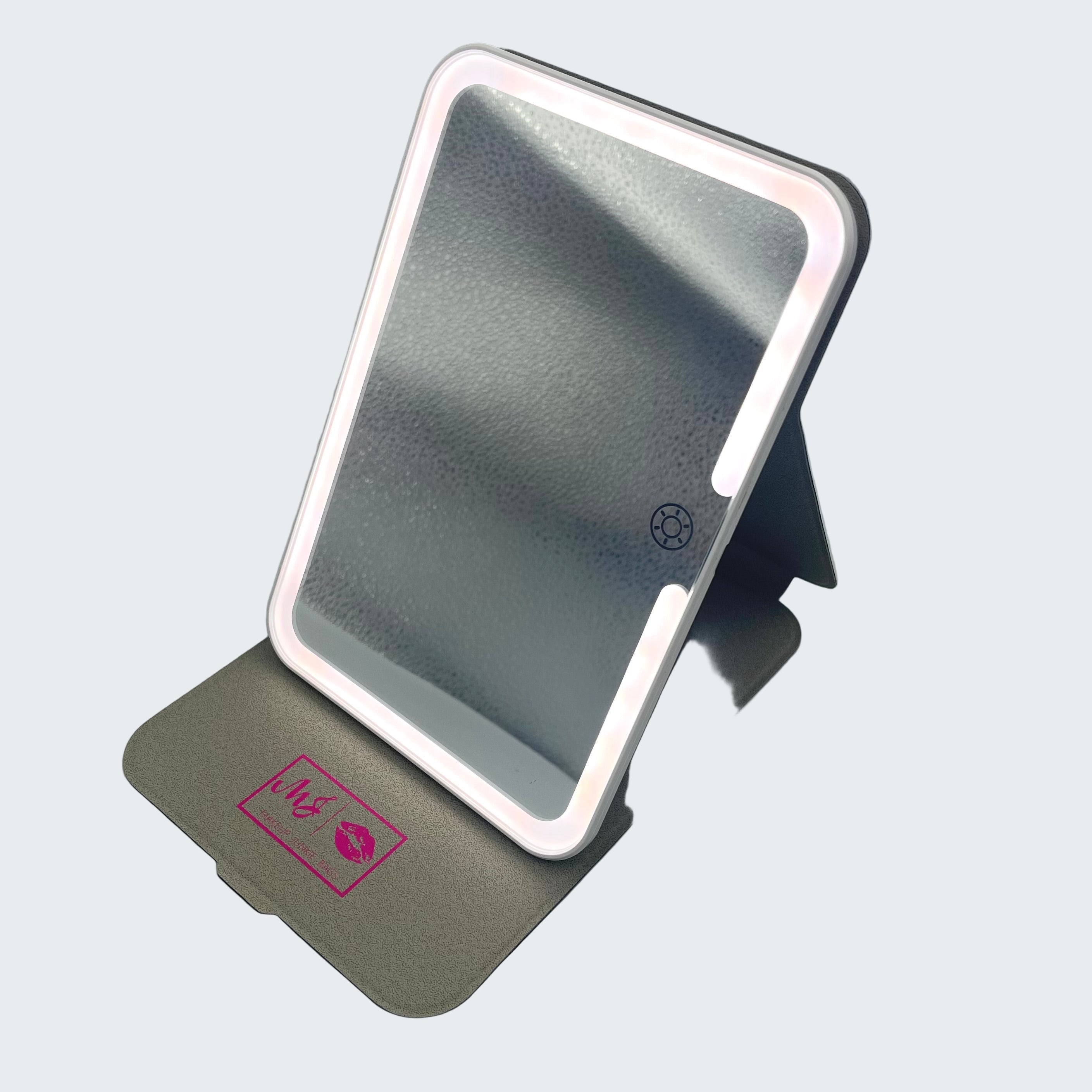 Makeup mirror with LED lights on a gray background