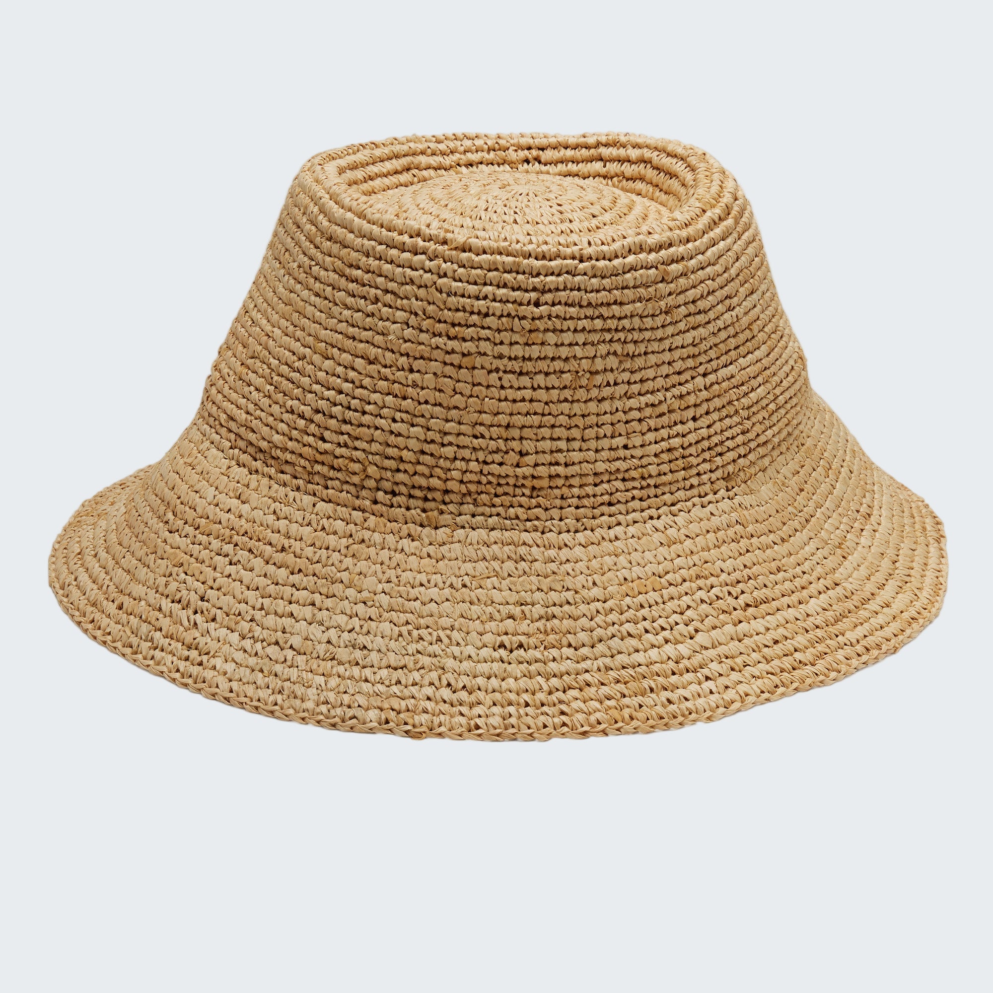 Beige woven bucket hat on a white background