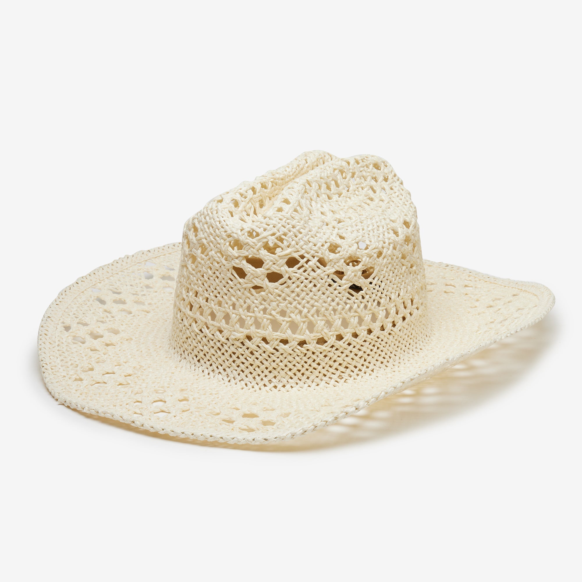 Beige straw hat with wide brim on a white background