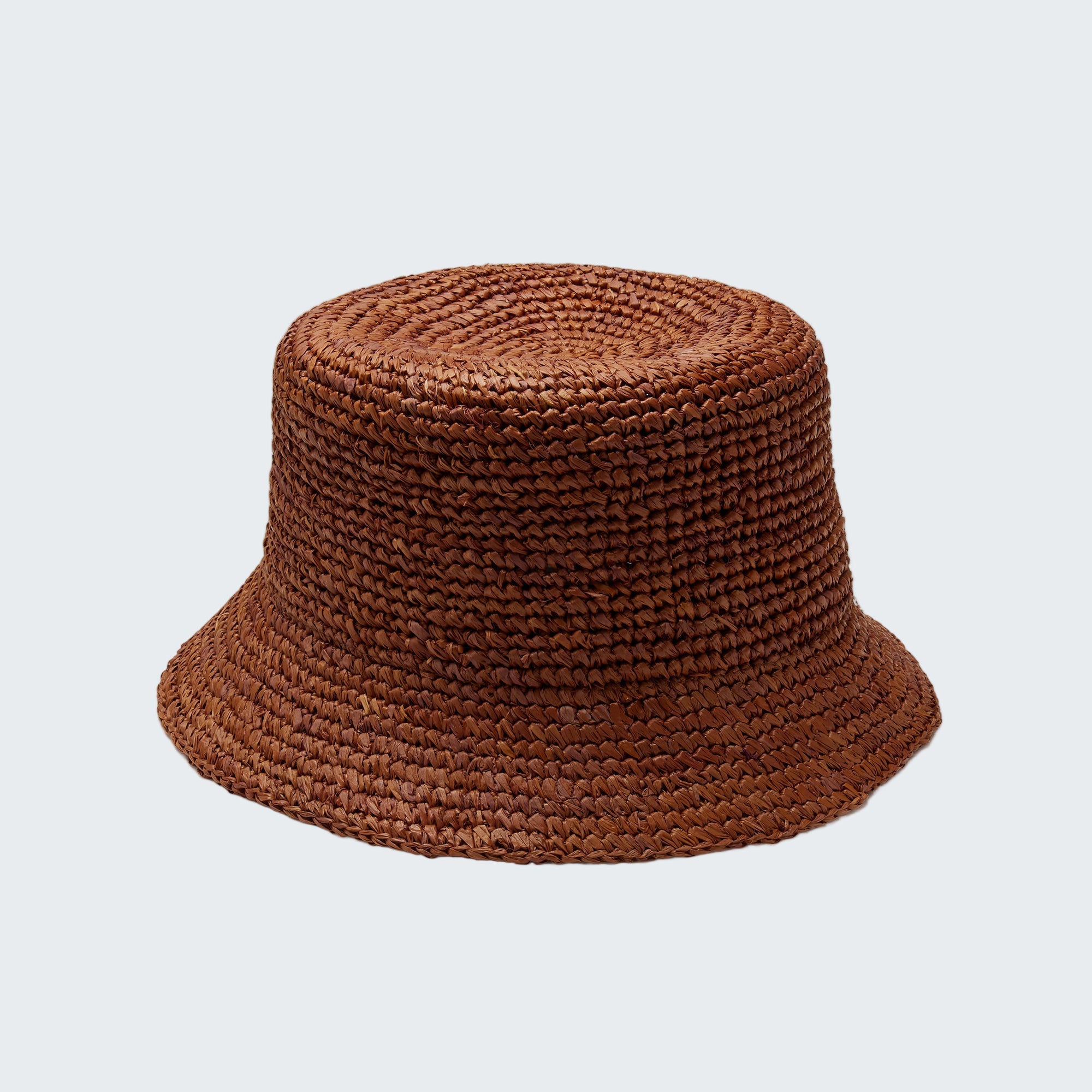 Brown woven bucket hat on a white background