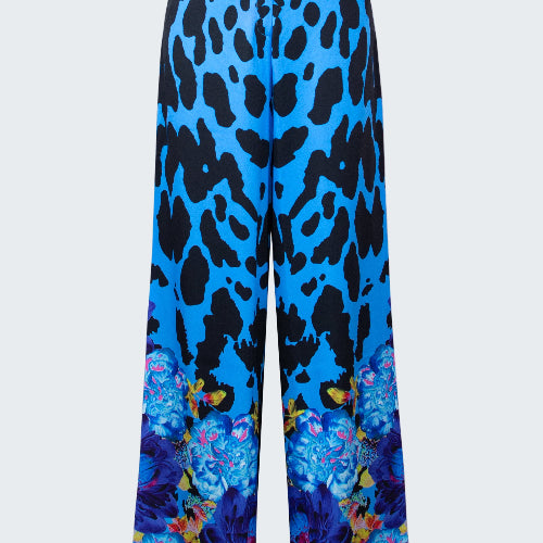 Blue pants with black leopard print and colorful butterfly design on a white background