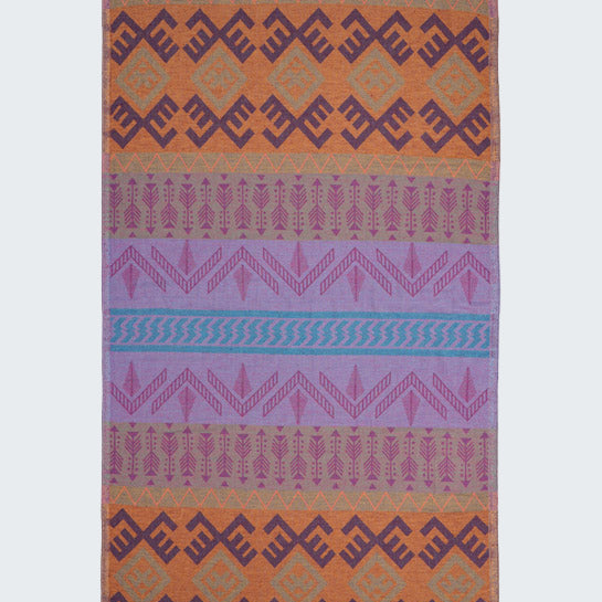 Multicolored patterned rug with geometric design on a white background