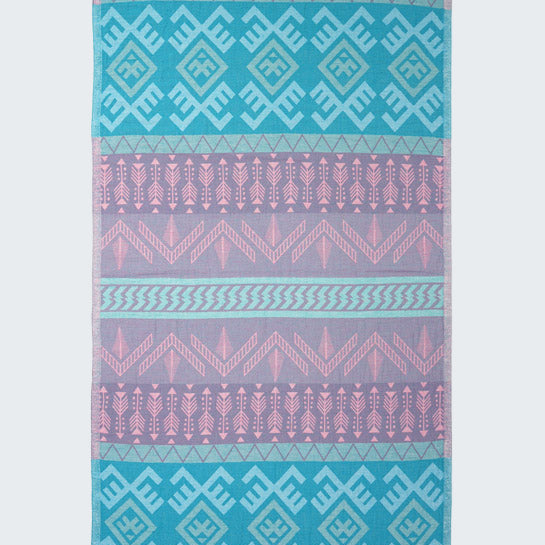 Patterned towel with blue and pink geometric design on a white background