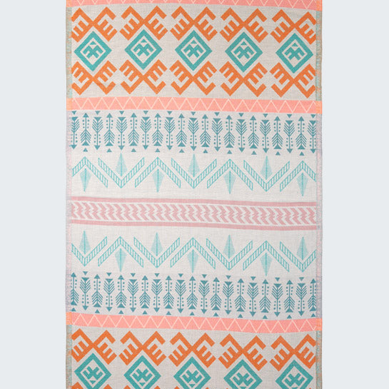Patterned rug with geometric design on a white background