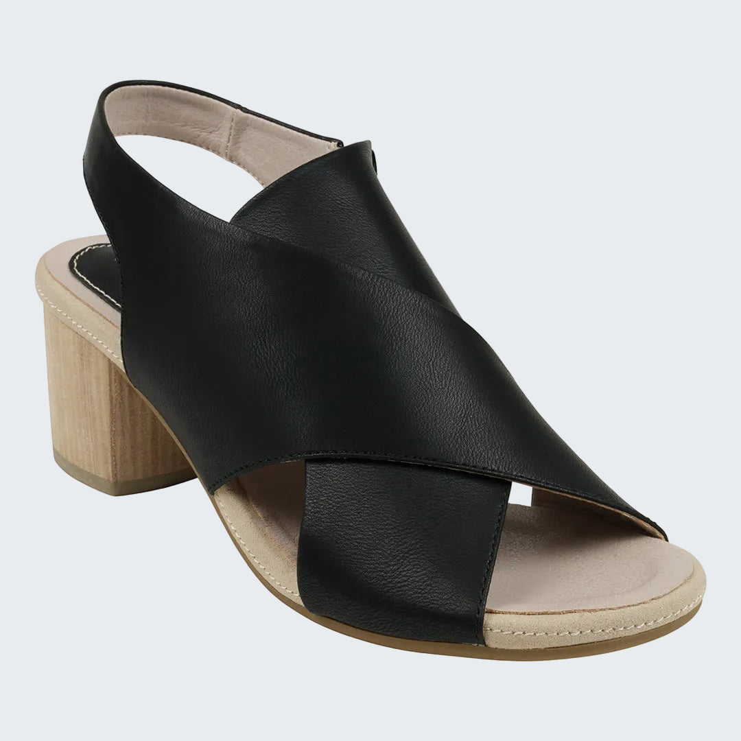 Black sandal with a wooden heel on a white background