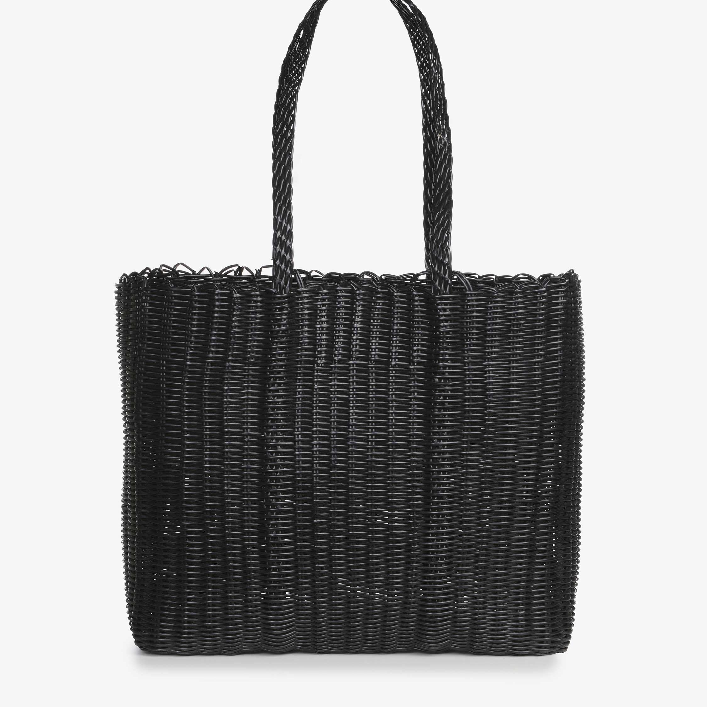 Black woven handbag on a white background