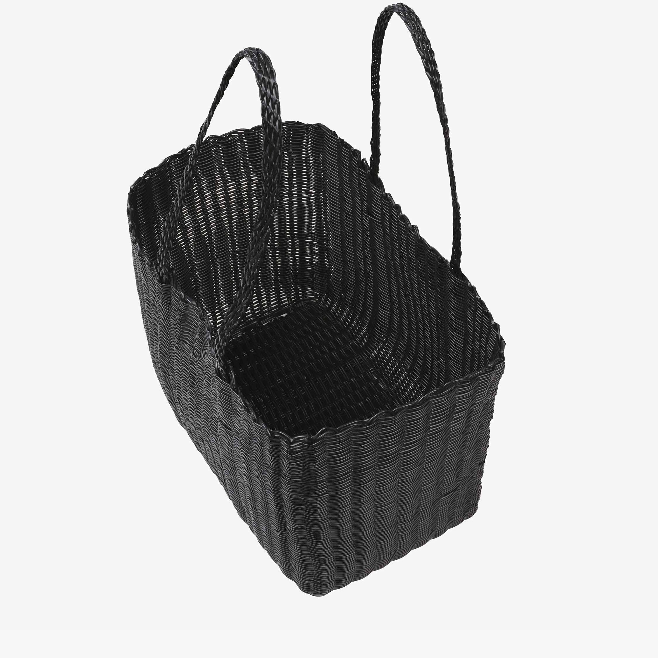 Black woven basket with handles on a white background