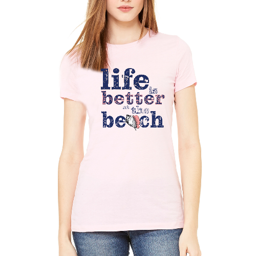 Person wearing a pink t-shirt with 'Life is better at the beach' text and sailboat graphic.
