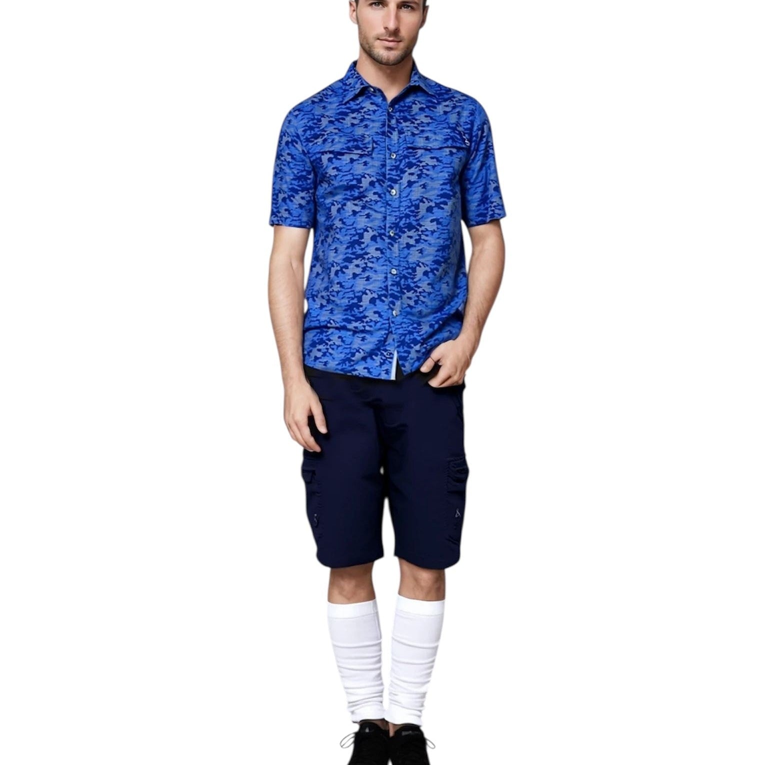 Man wearing a blue patterned shirt and navy shorts on a white background