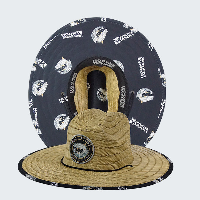 Two hats, one straw and one navy with white patterns, on a white background.