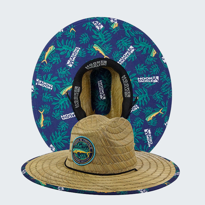 Tan straw hat with blue patterned headband on a white background