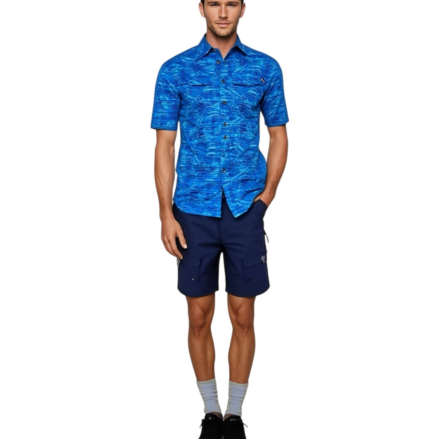 Man wearing a blue patterned shirt and navy shorts on a white background