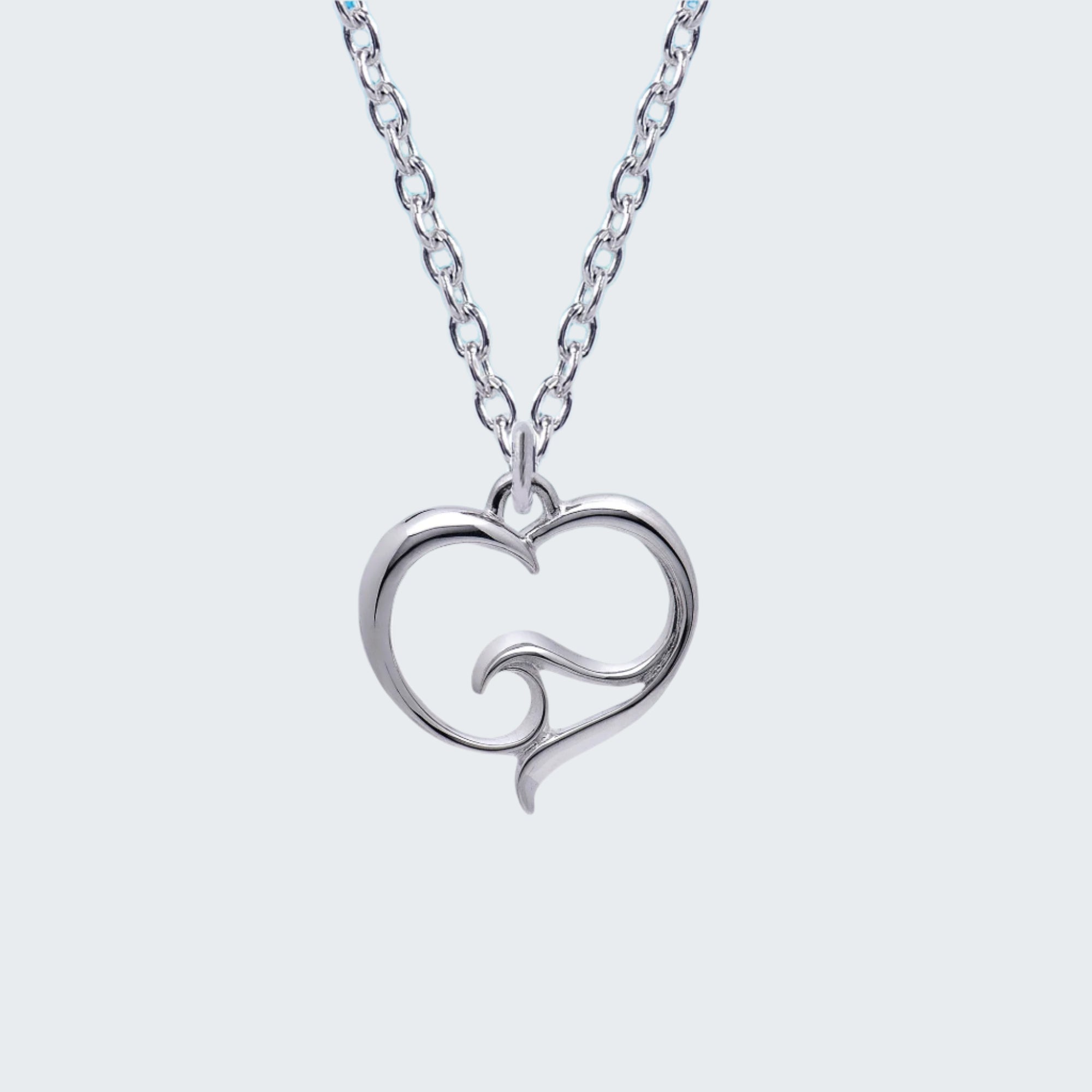 Silver necklace with a heart-shaped pendant on a light gray background