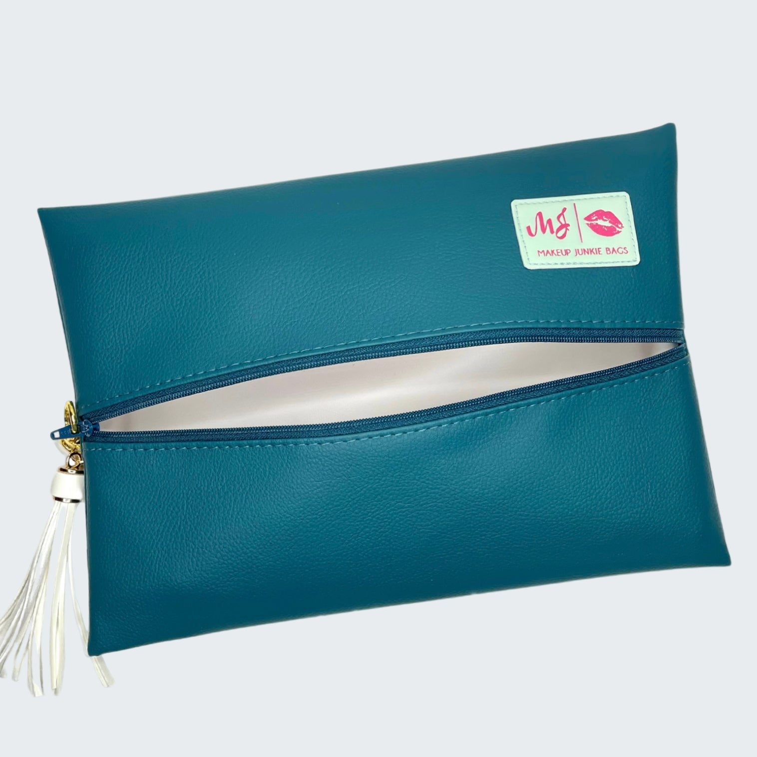 Teal clutch bag with a visible brand logo on a white background