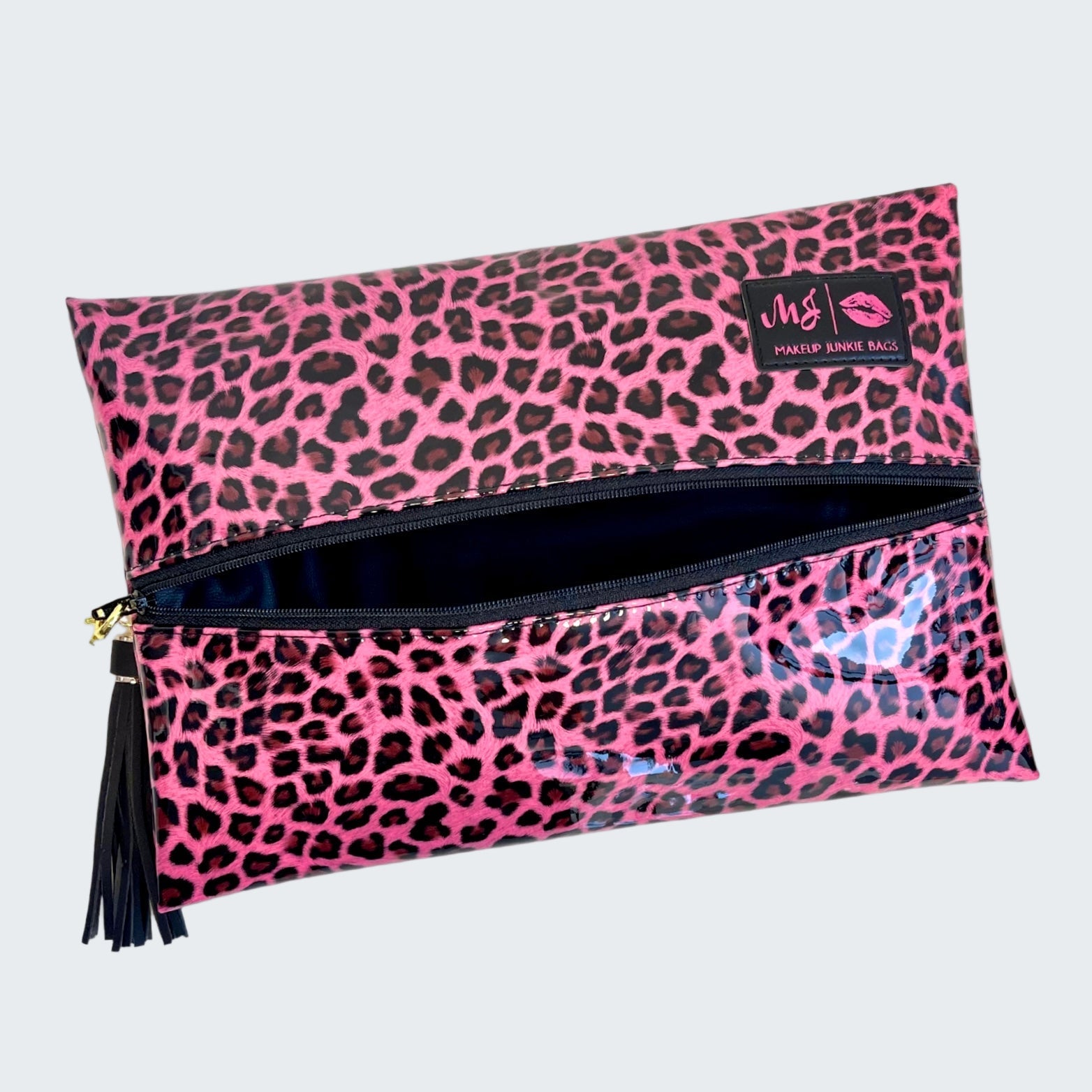 Pink leopard print makeup bag with a visible brand logo on a white background
