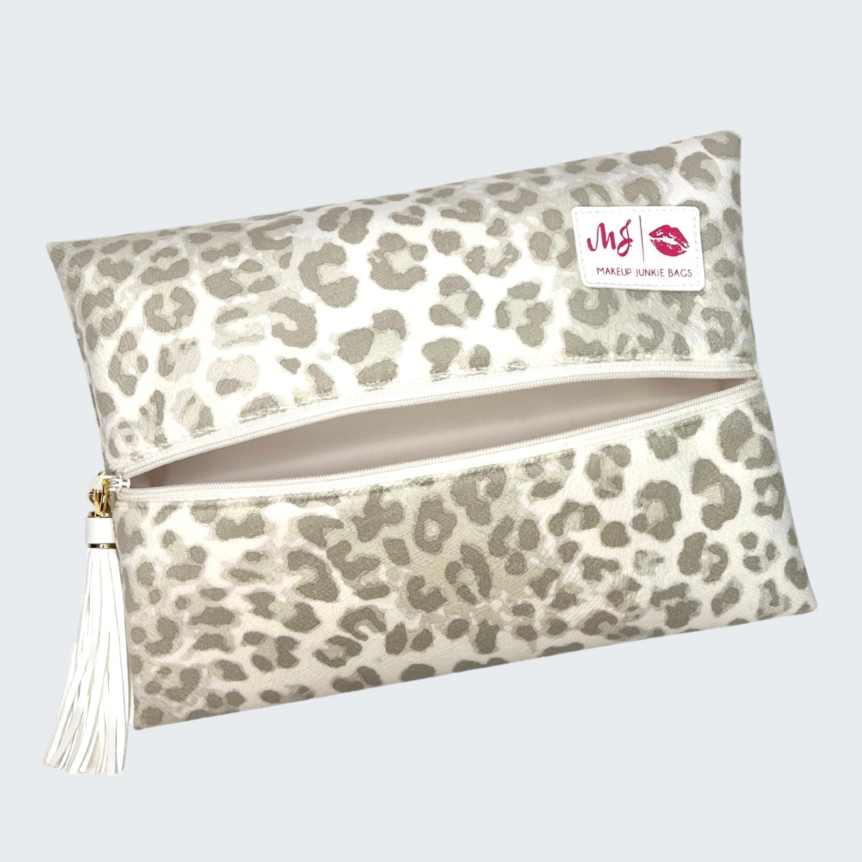 Leopard print makeup bag with a visible brand label on a white background