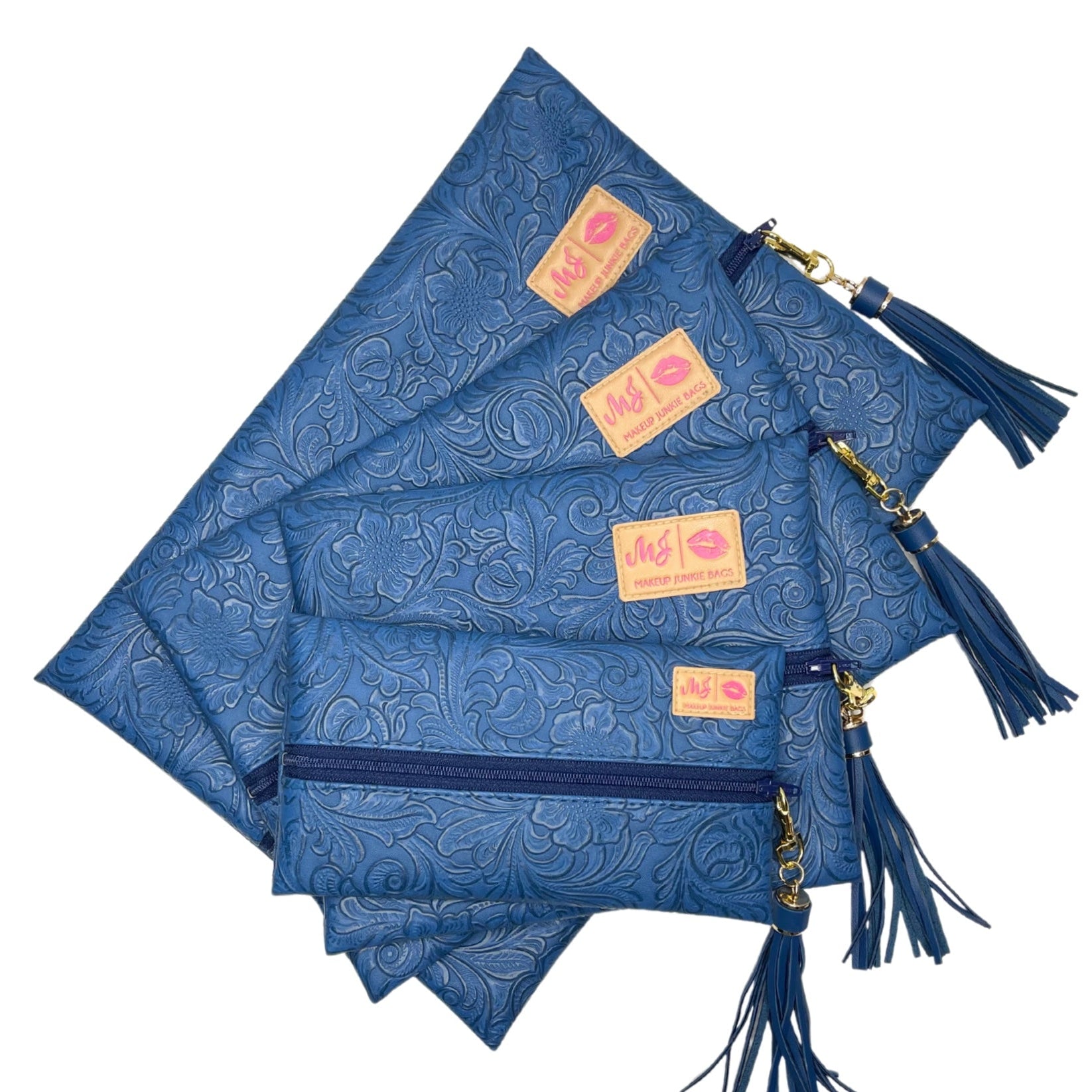Set of blue patterned pouches with tassels and visible branding on a white background