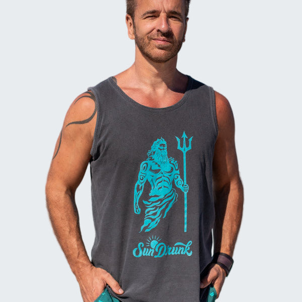 Man wearing a tank top with a graphic design on a beach
