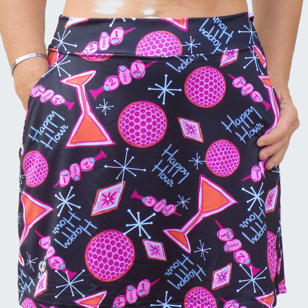 Skirt with a colorful pattern of golf balls, cocktail glasses, and text on a black background