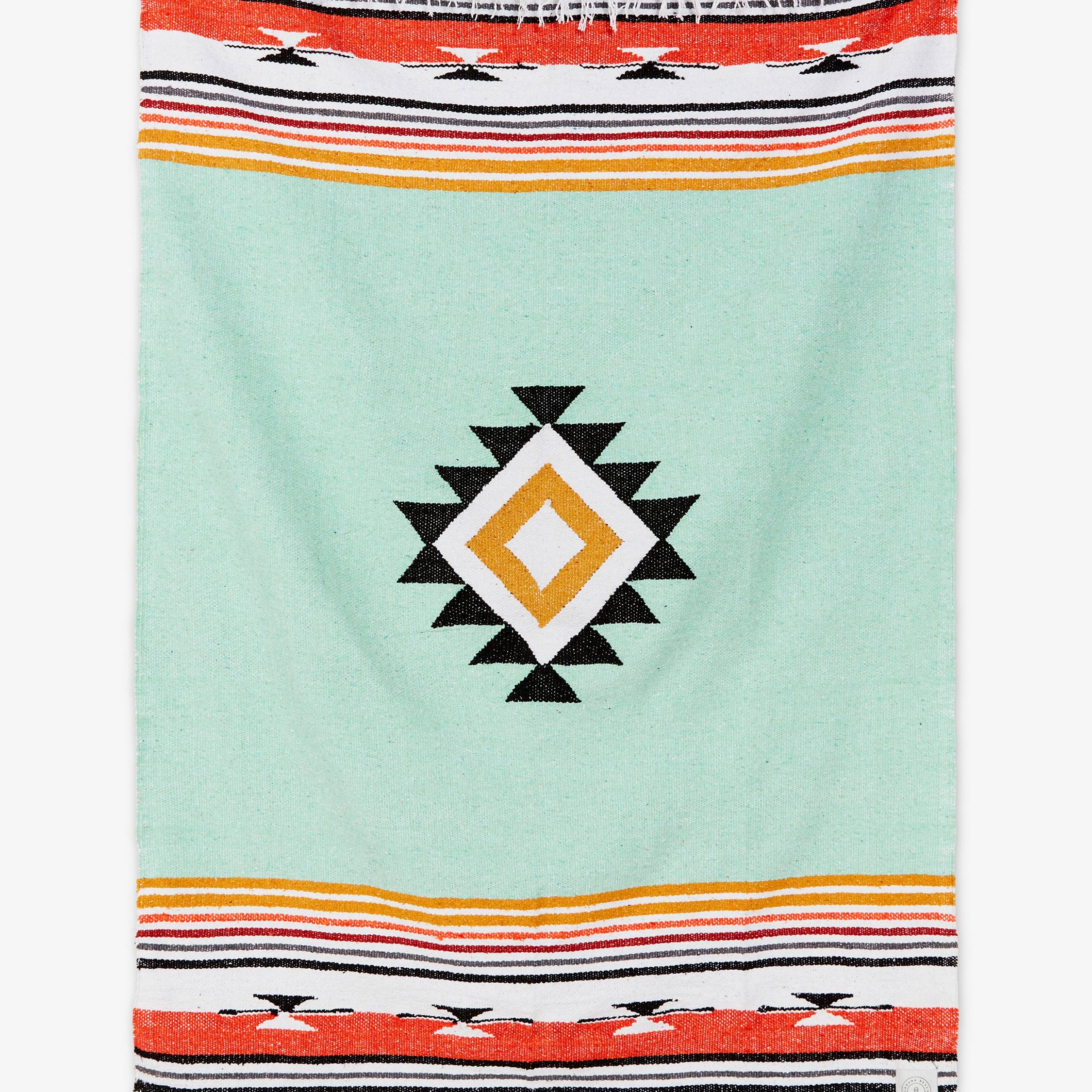 Colorful towel with geometric pattern on a light blue background