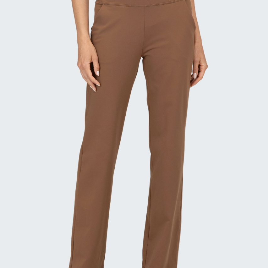 Brown pants worn by a person on a white background