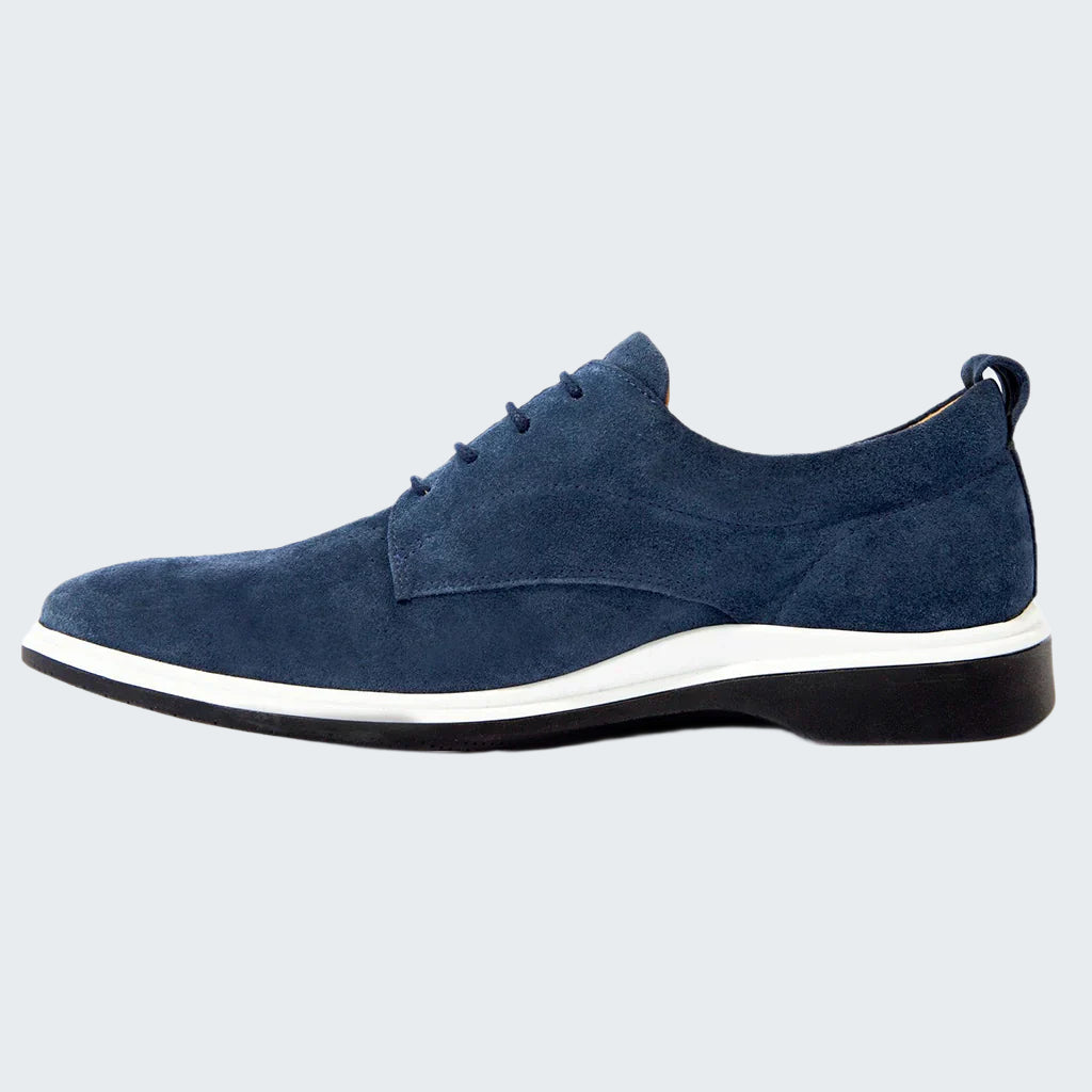 Blue suede shoe with a white sole on a white background