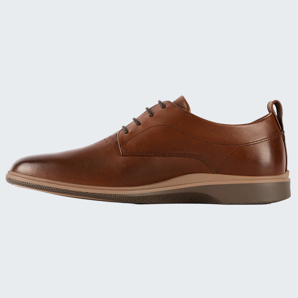 Brown leather shoe on a white background