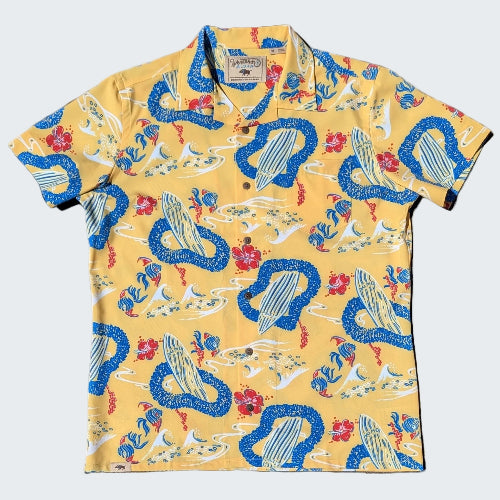 Colorful shirt with snake and floral pattern on a yellow background