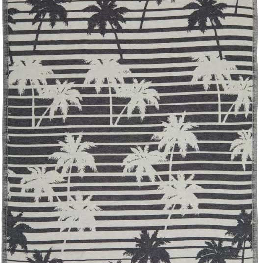 Towel with palm tree pattern on a striped background