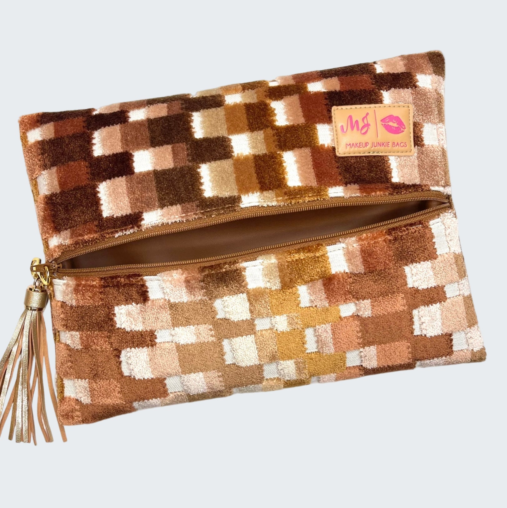 Checkered patterned pouch with a tassel on a white background