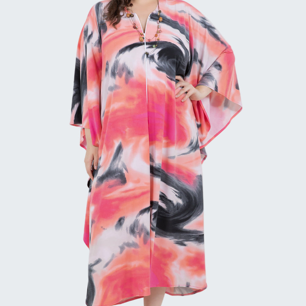 Woman wearing a colorful dress with abstract patterns on a white background