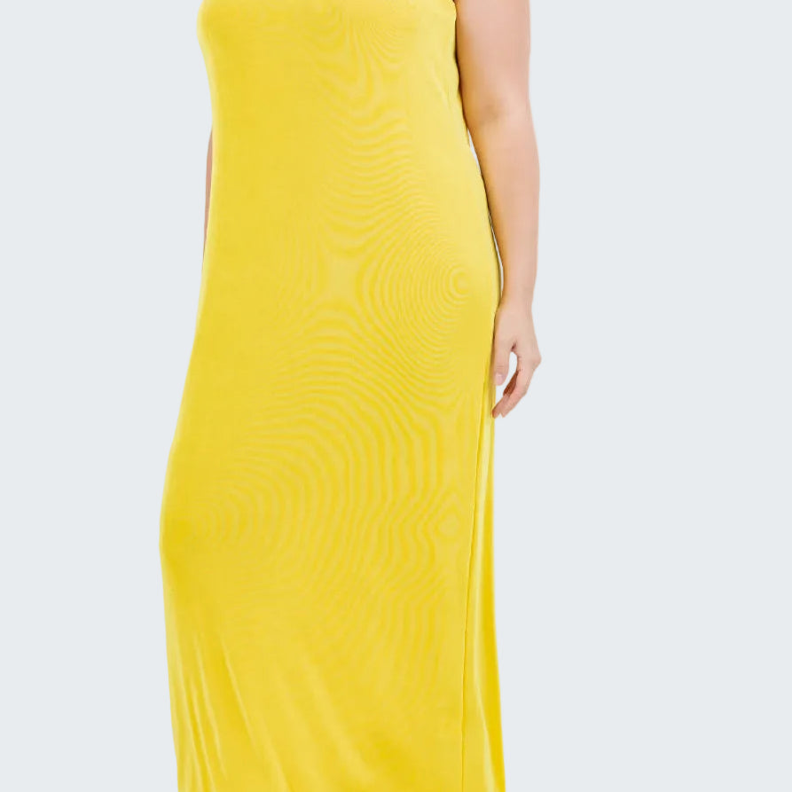 Woman wearing a yellow sleeveless dress on a white background