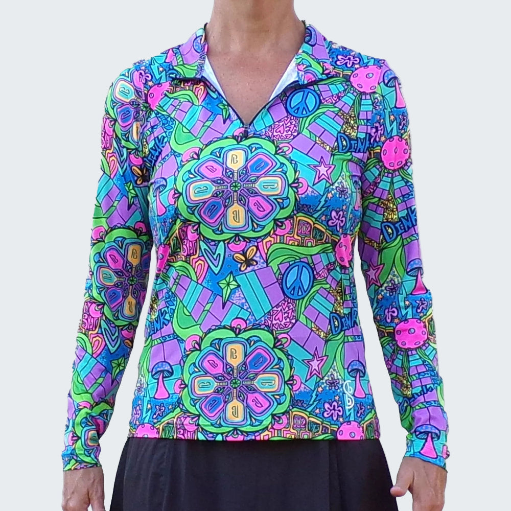 Colorful patterned shirt with long sleeves on a plain background