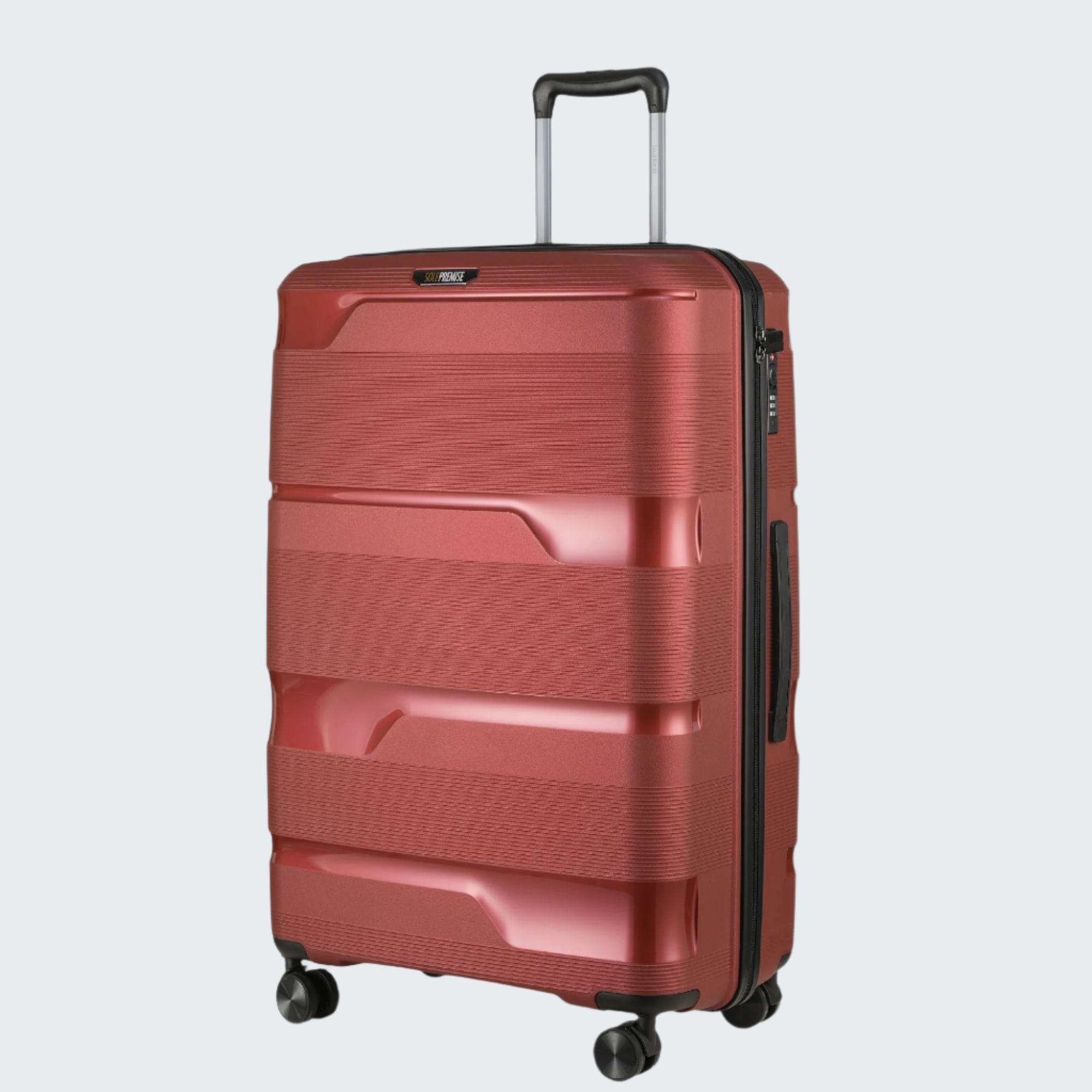 Red suitcase with a textured surface on a light gray background