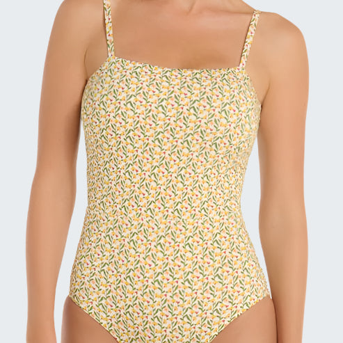Floral patterned one-piece swimsuit worn by a model on a white background