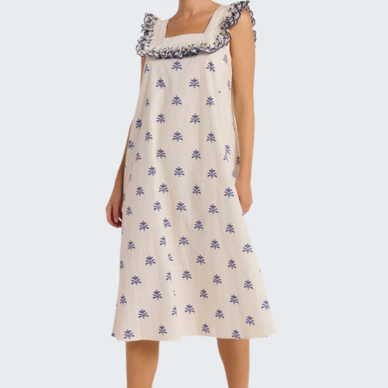 Woman wearing a floral nightgown on a white background