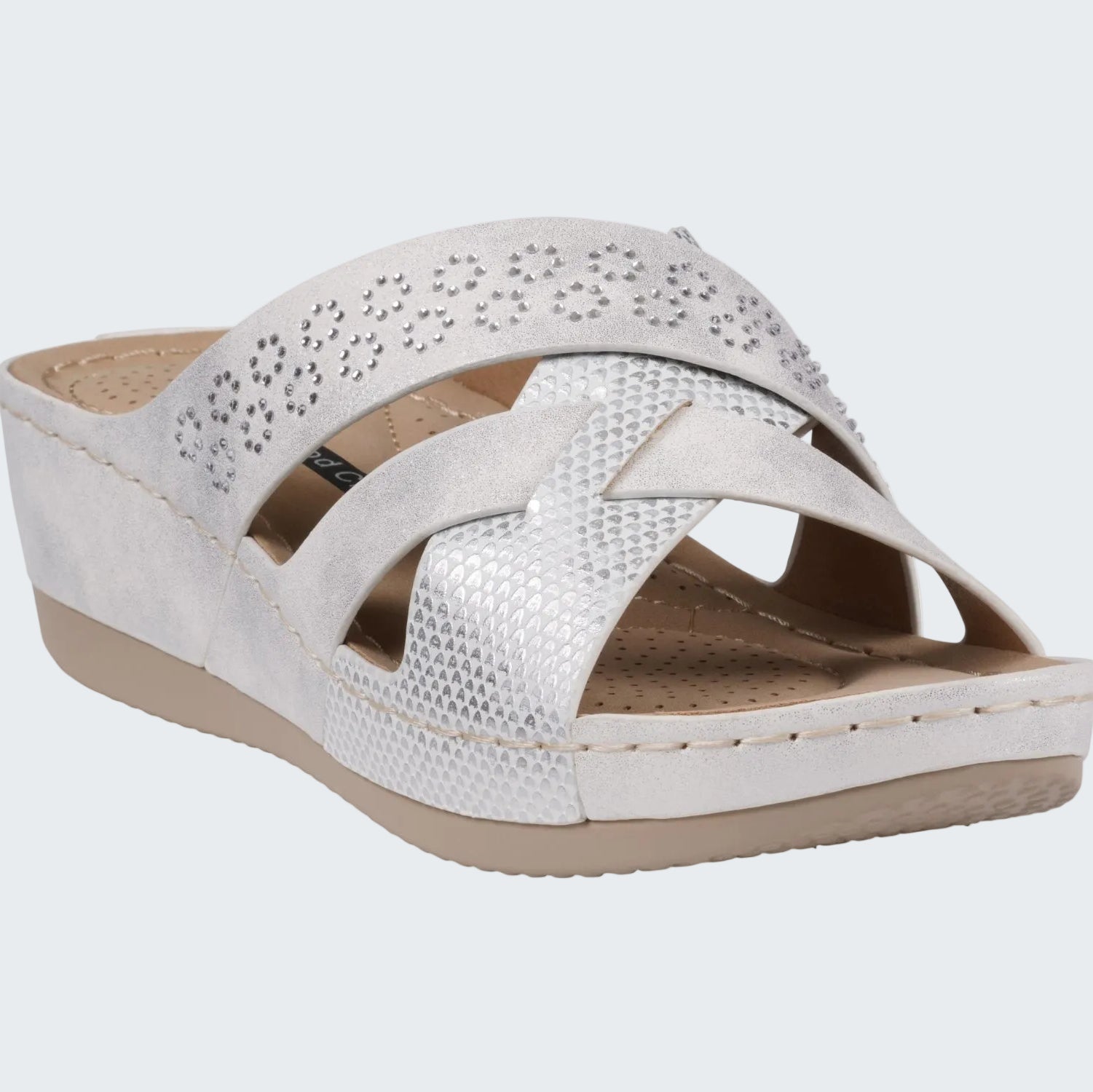 White wedge sandal with a strap on a white background